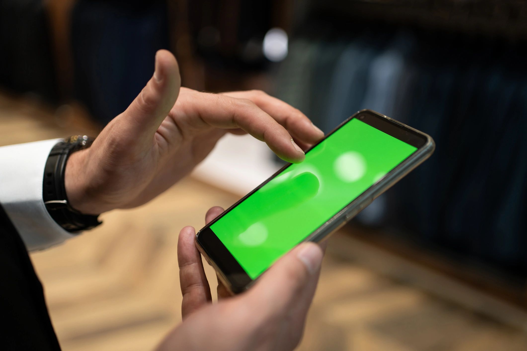 Small business manager using a phone representing mobile optimization